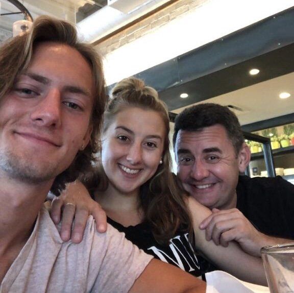 SLU football player Alex Shterenberg with his sister, Dasha, and father, Henry